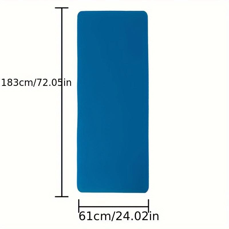A non-slip sports yoga mat laid out for a dead bug core workout
