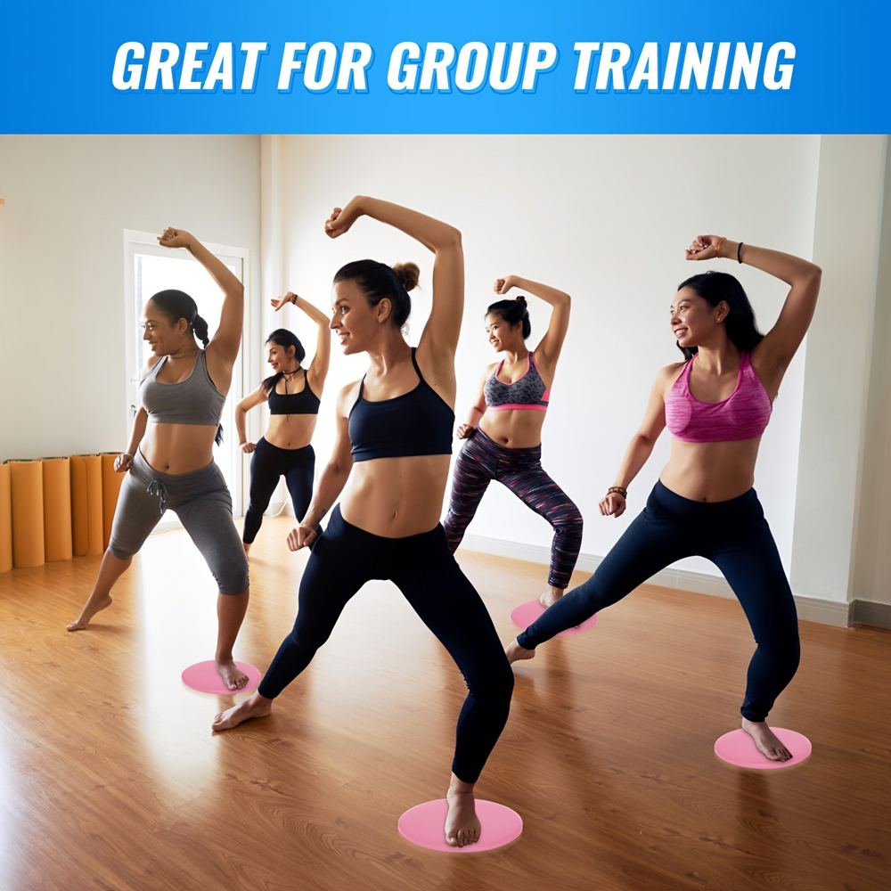Pink dual-sided core sliders for adding challenge to home core workouts