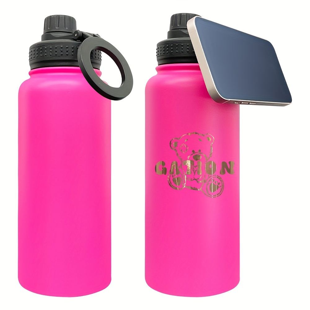 An insulated gym water bottle with a magnetic phone holder for filming workouts