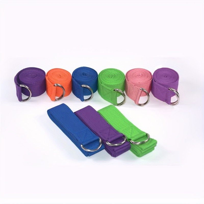 A nylon yoga strap with a metal D-ring, looped and ready for stretching