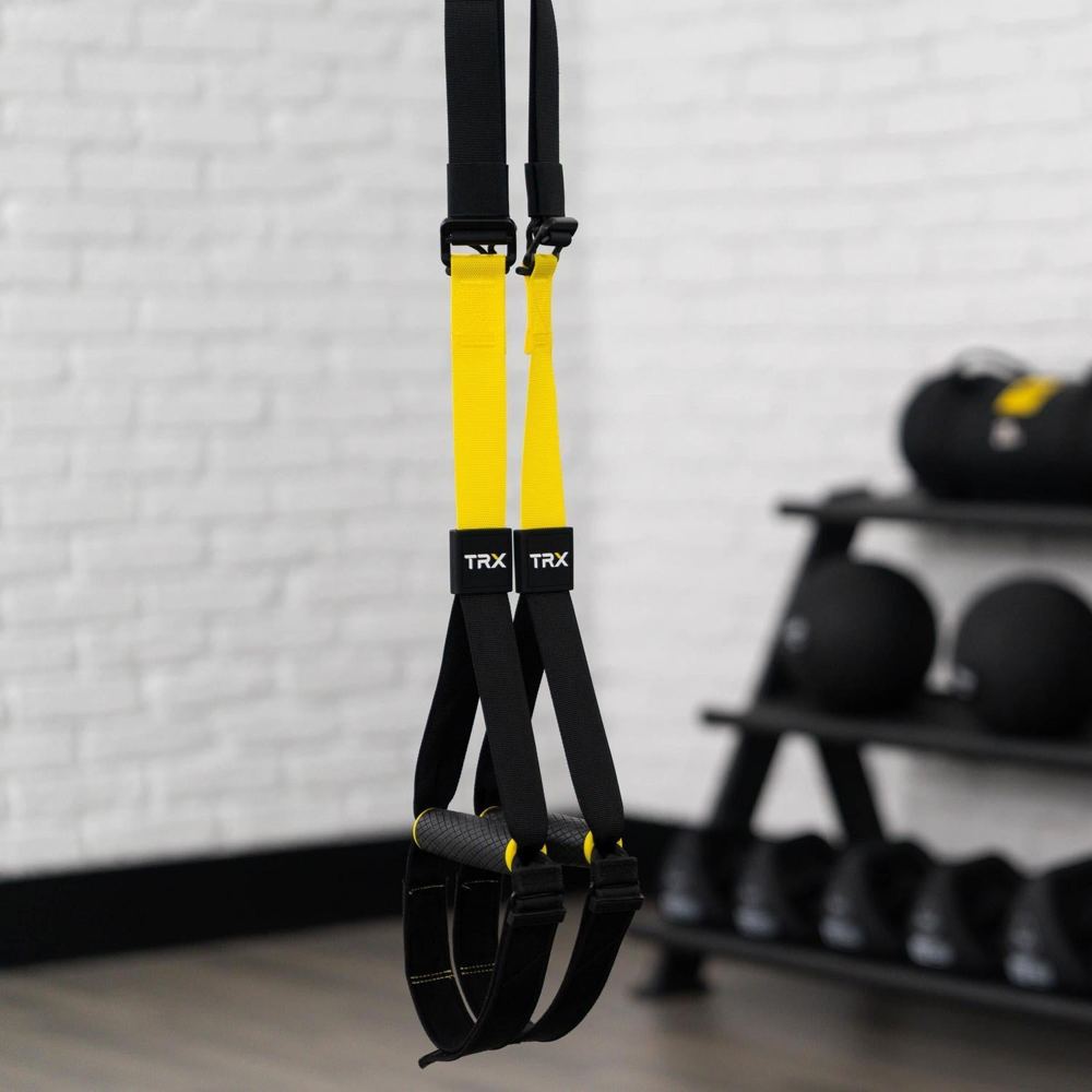 A commercial-grade suspension trainer with padded handles